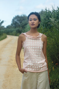 Elementum multifunctional seashell pink top with silkscreen print dots in white.