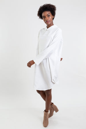 Multifunctional white shirt which can be worn as a long shirt, dress or tunic.