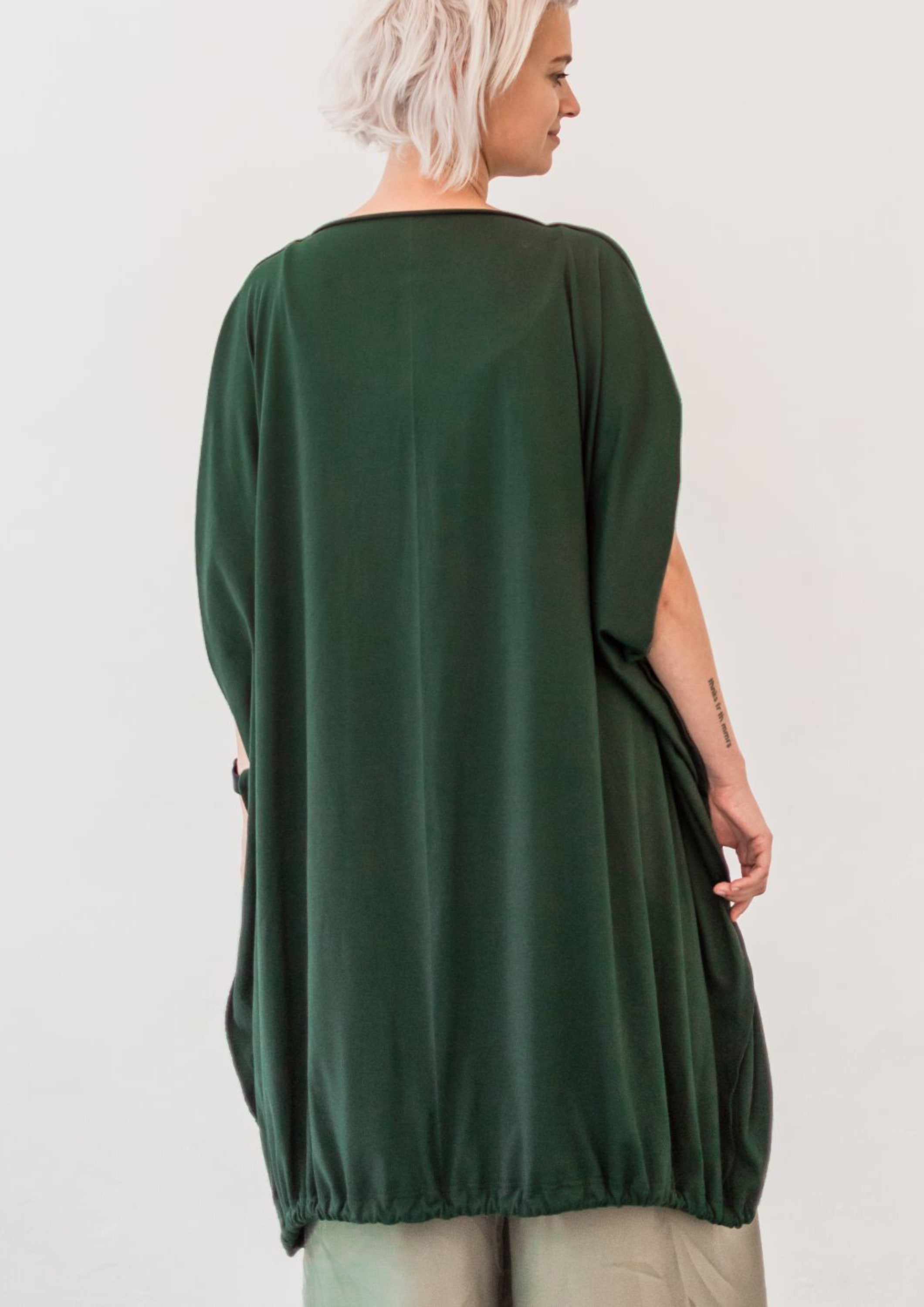 Multifunctional Wide dress in deep green. Can be worn as a dress, vest, poncho and blouse/top. Flowing and soft jersey, with adjustable draw-string to regulate the shape.